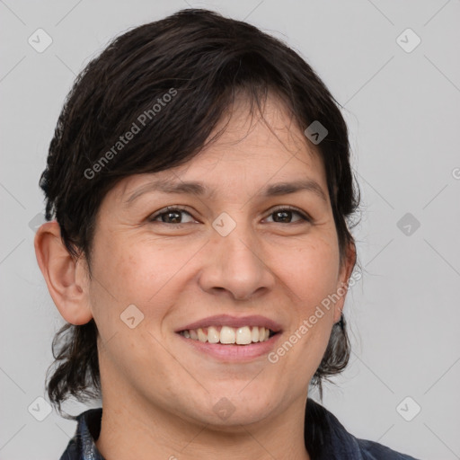 Joyful white adult female with medium  brown hair and brown eyes