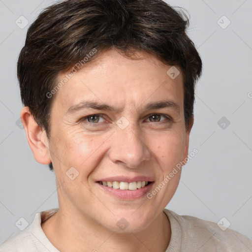 Joyful white adult male with short  brown hair and grey eyes