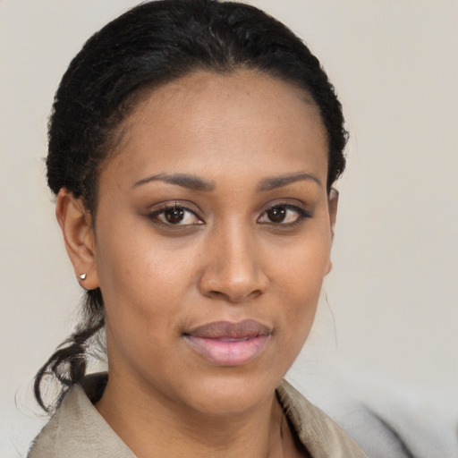 Joyful latino young-adult female with short  brown hair and brown eyes