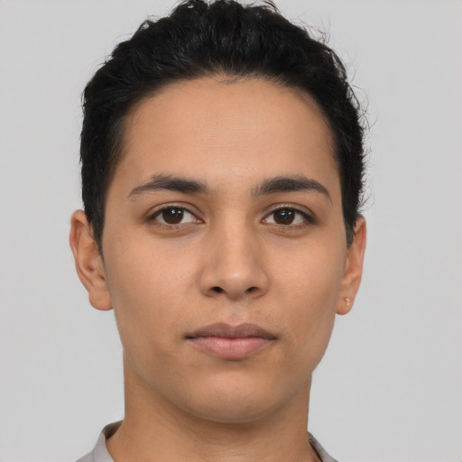 Neutral latino young-adult male with short  brown hair and brown eyes