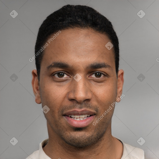 Joyful black young-adult male with short  black hair and brown eyes