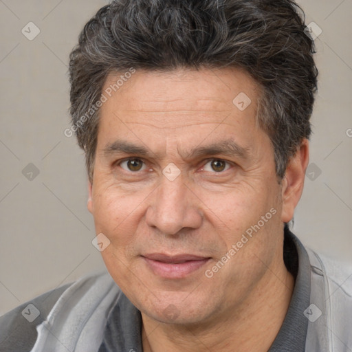 Joyful white middle-aged male with short  brown hair and brown eyes