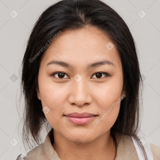 Joyful latino young-adult female with medium  brown hair and brown eyes