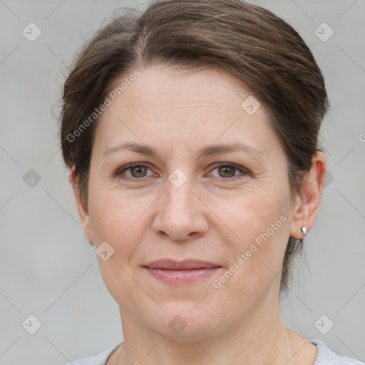 Joyful white adult female with short  brown hair and brown eyes