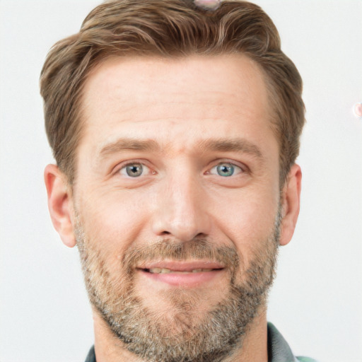 Joyful white adult male with short  brown hair and grey eyes