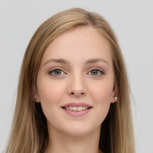 Joyful white young-adult female with long  brown hair and grey eyes