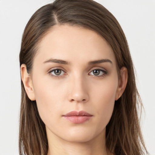 Neutral white young-adult female with long  brown hair and brown eyes