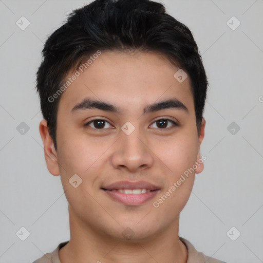 Joyful asian young-adult male with short  brown hair and brown eyes