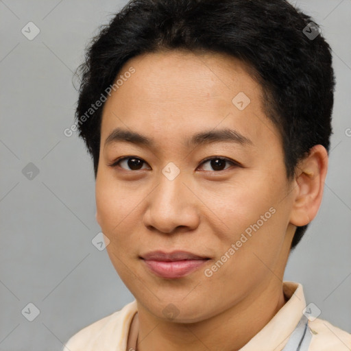 Joyful asian young-adult male with short  brown hair and brown eyes