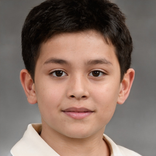 Joyful white child male with short  brown hair and brown eyes