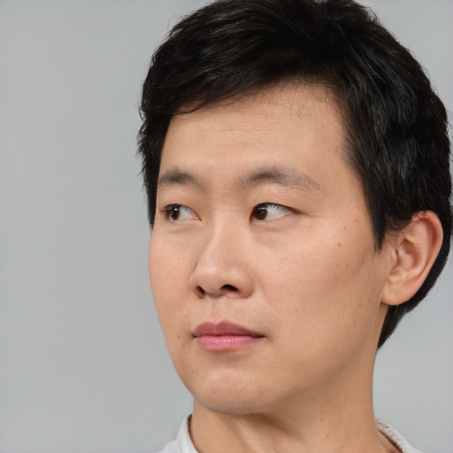 Neutral asian young-adult male with short  black hair and brown eyes