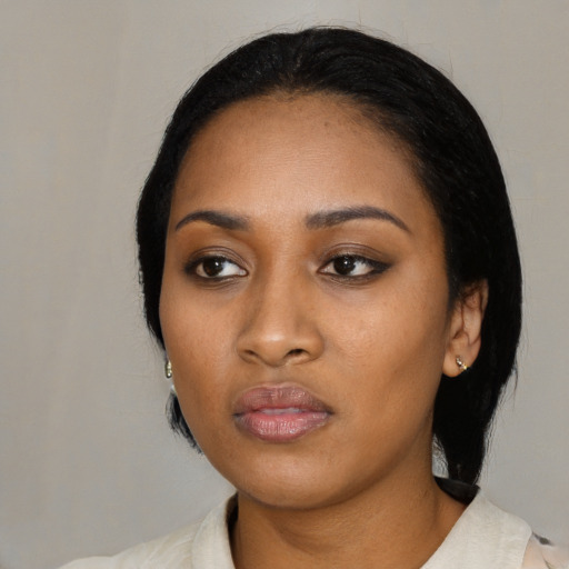 Neutral black young-adult female with medium  black hair and brown eyes