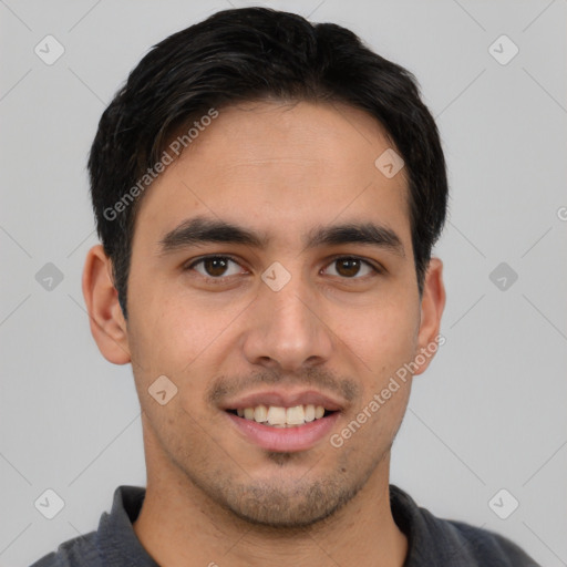 Joyful latino young-adult male with short  brown hair and brown eyes