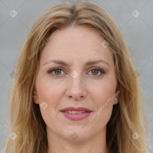 Joyful white adult female with long  brown hair and brown eyes