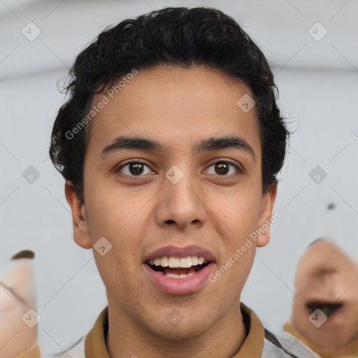 Joyful latino young-adult male with short  brown hair and brown eyes