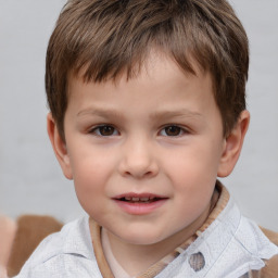 Joyful white child male with short  brown hair and brown eyes