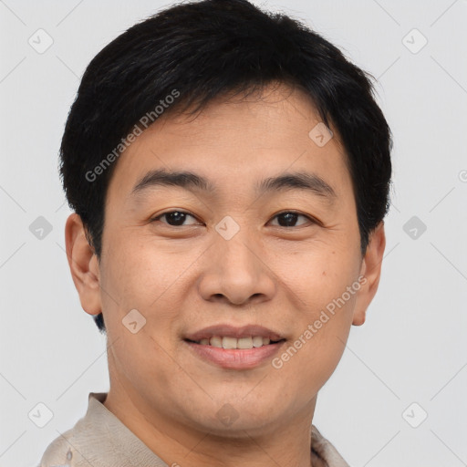 Joyful asian young-adult male with short  brown hair and brown eyes