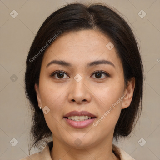 Joyful latino young-adult female with medium  brown hair and brown eyes