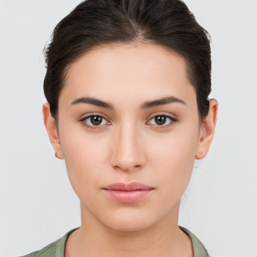 Neutral white young-adult female with short  brown hair and brown eyes