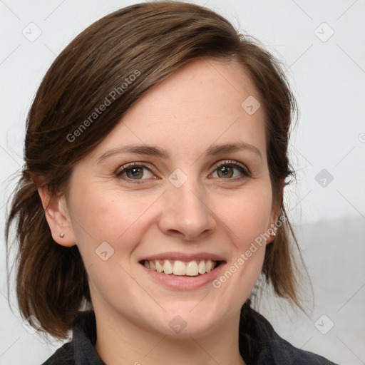 Joyful white adult female with medium  brown hair and blue eyes