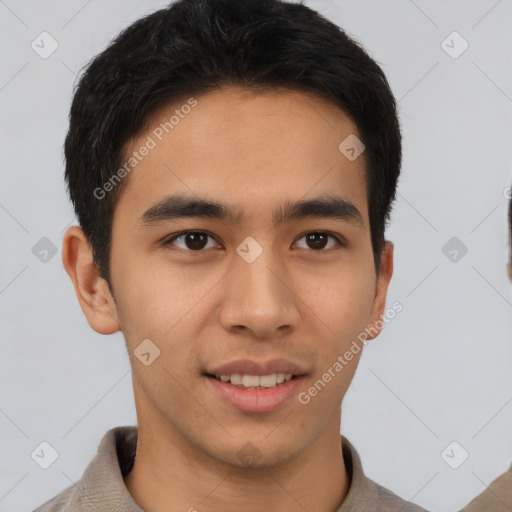 Joyful asian young-adult male with short  black hair and brown eyes