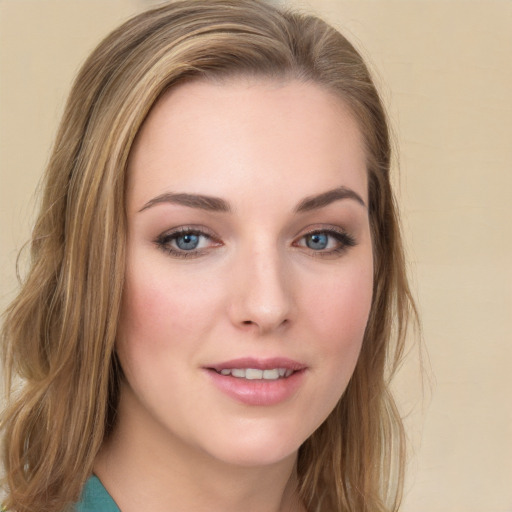 Joyful white young-adult female with long  brown hair and green eyes