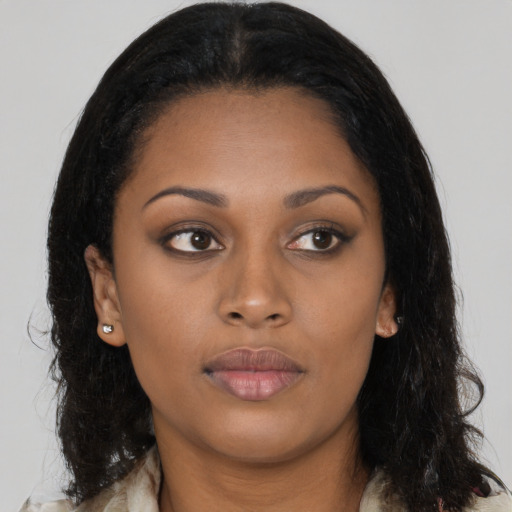 Neutral black young-adult female with long  brown hair and brown eyes