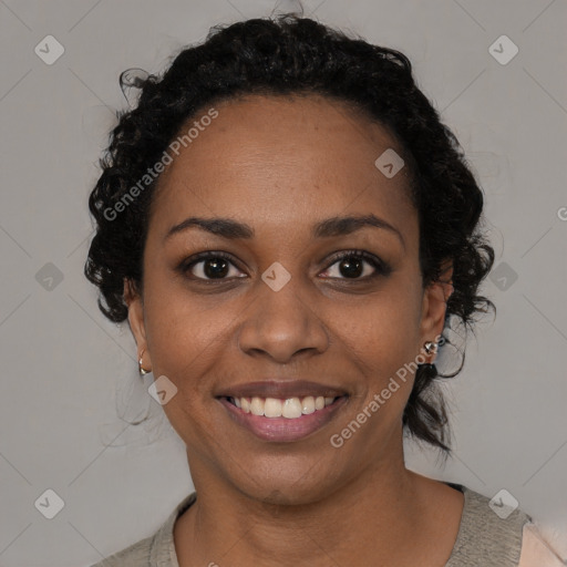 Joyful black young-adult female with medium  black hair and brown eyes