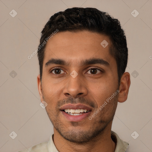 Joyful white young-adult male with short  black hair and brown eyes