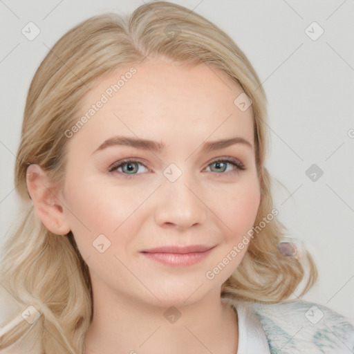 Joyful white young-adult female with long  blond hair and blue eyes