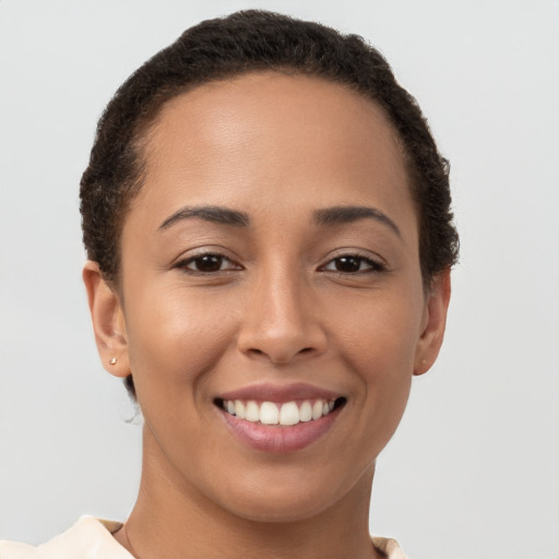 Joyful white young-adult female with short  brown hair and brown eyes