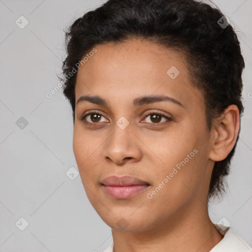 Joyful latino young-adult female with short  brown hair and brown eyes