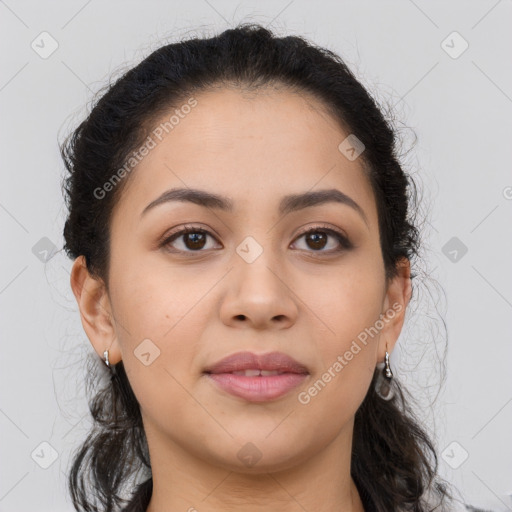 Joyful latino young-adult female with long  brown hair and brown eyes