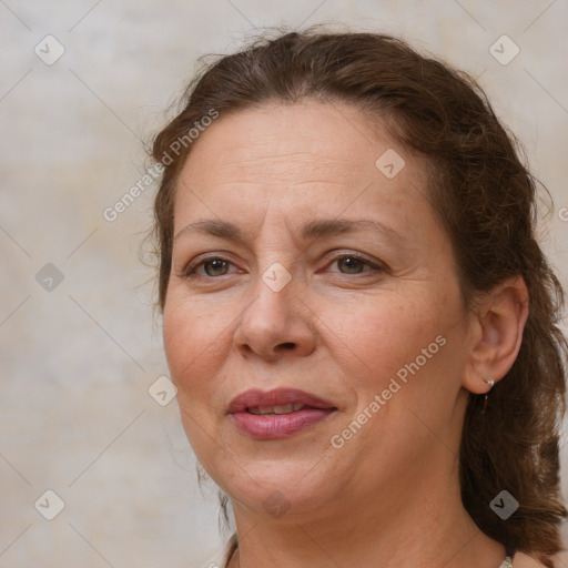 Joyful white adult female with medium  brown hair and brown eyes