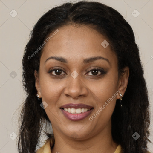 Joyful black young-adult female with long  brown hair and brown eyes