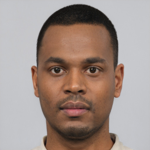 Neutral black young-adult male with short  black hair and brown eyes