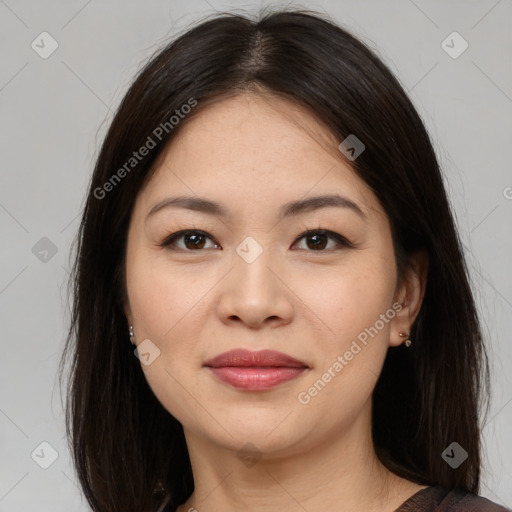 Joyful asian young-adult female with long  brown hair and brown eyes