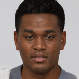 Neutral black young-adult male with short  black hair and brown eyes