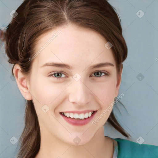 Joyful white young-adult female with long  brown hair and blue eyes