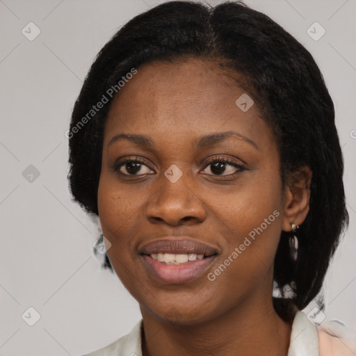 Joyful black young-adult female with medium  black hair and brown eyes