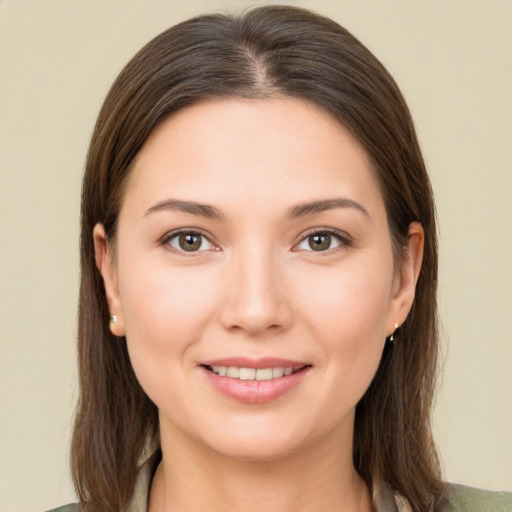 Joyful white young-adult female with medium  brown hair and brown eyes