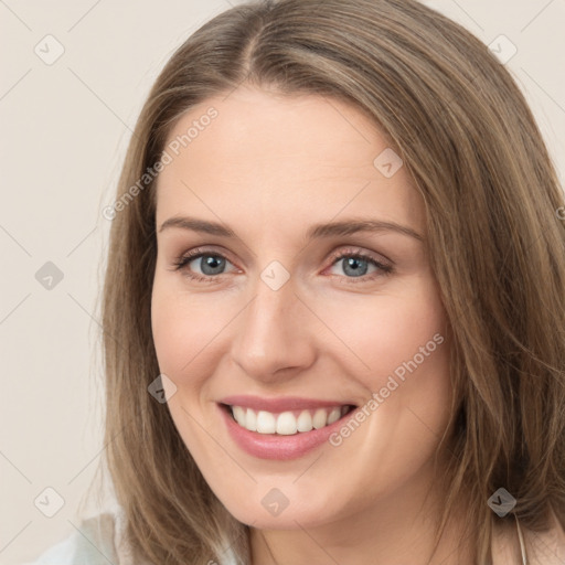 Joyful white young-adult female with long  brown hair and green eyes