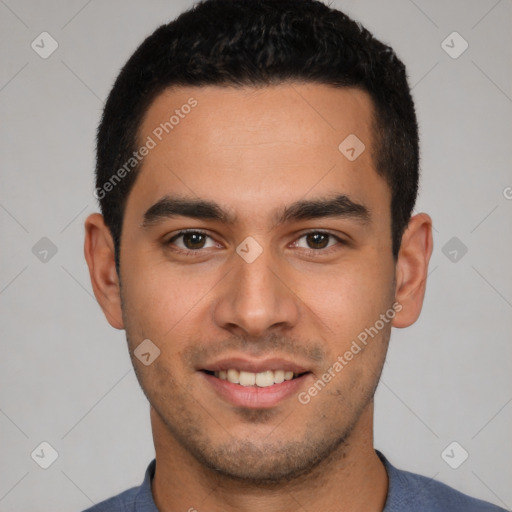 Joyful white young-adult male with short  black hair and brown eyes