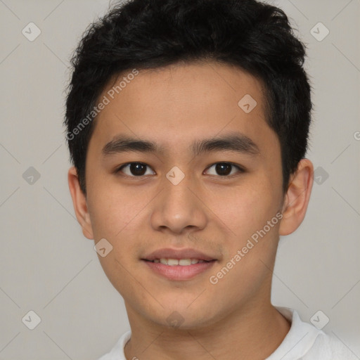 Joyful asian young-adult male with short  brown hair and brown eyes