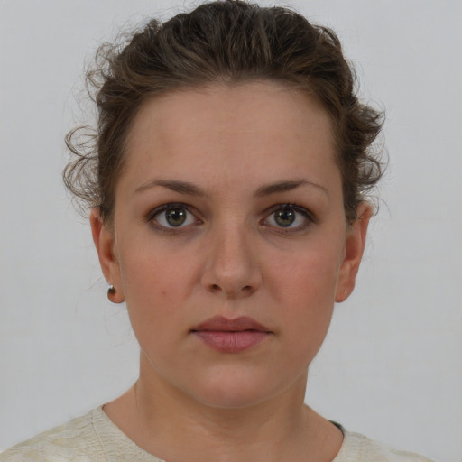 Neutral white young-adult female with short  brown hair and brown eyes