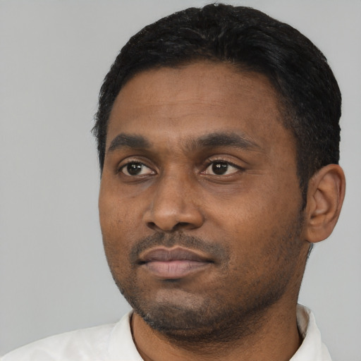 Neutral black young-adult male with short  black hair and brown eyes