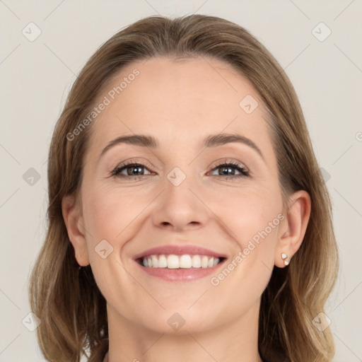 Joyful white young-adult female with medium  brown hair and grey eyes