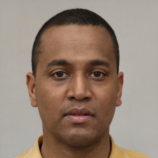 Neutral latino young-adult male with short  brown hair and brown eyes