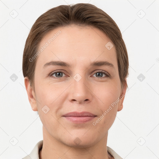 Joyful white young-adult female with short  brown hair and grey eyes