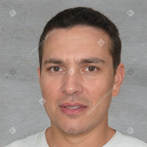 Joyful white adult male with short  brown hair and brown eyes